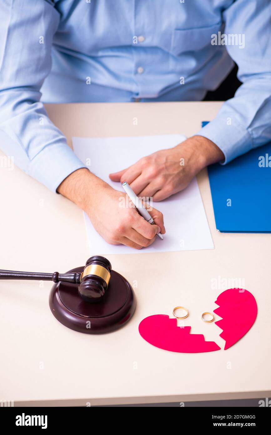 Young man in the courthouse in divorcing concept Stock Photo