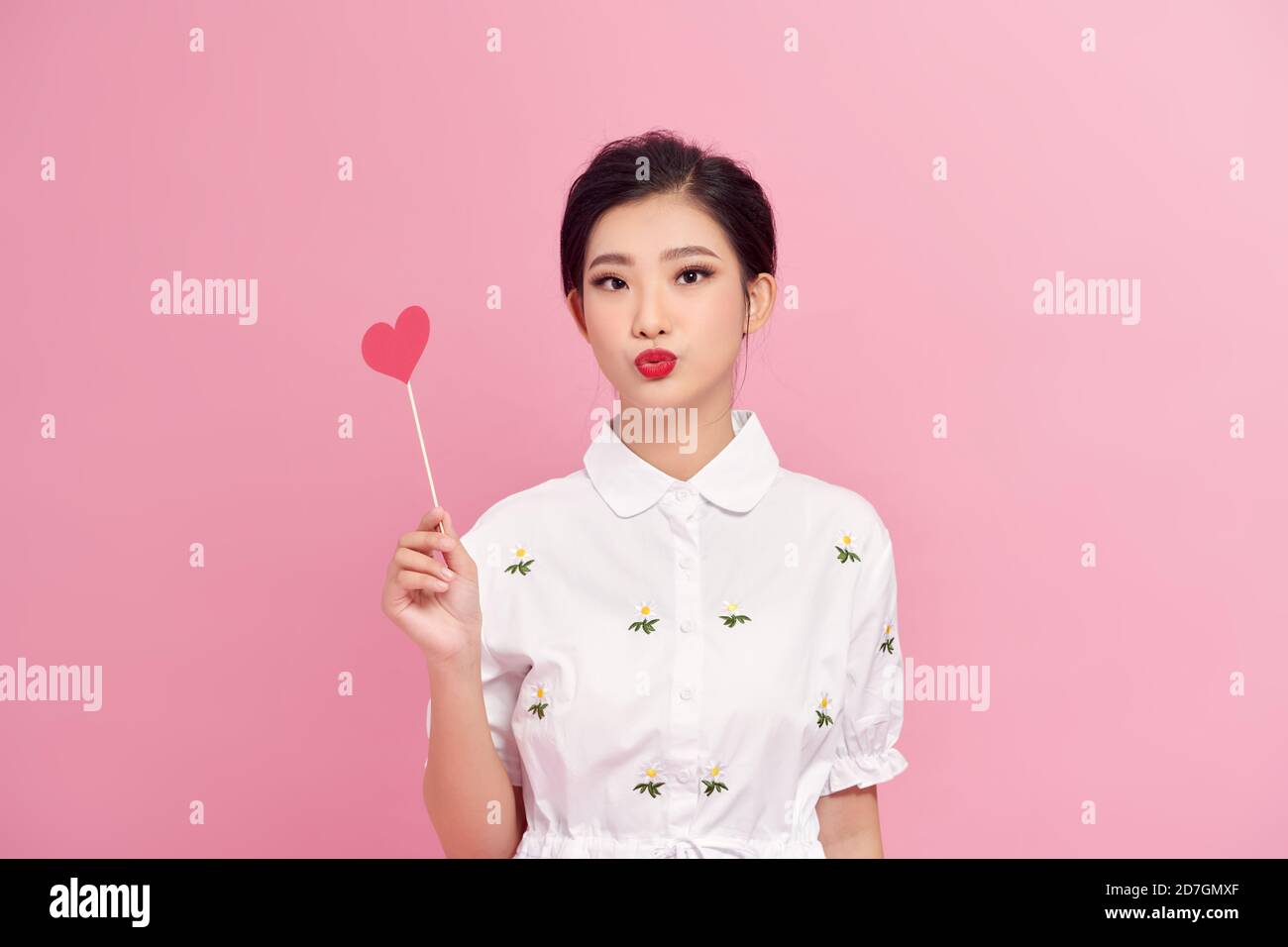 Portrait of pretty girl holding red paper heart on stick Stock Photo ...