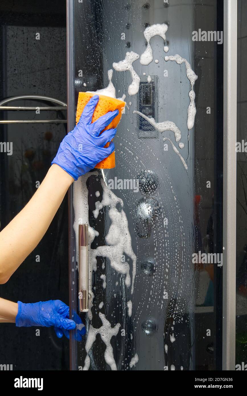 Cleaning of shower steam cabins from calcium deposits. Cleaning in the