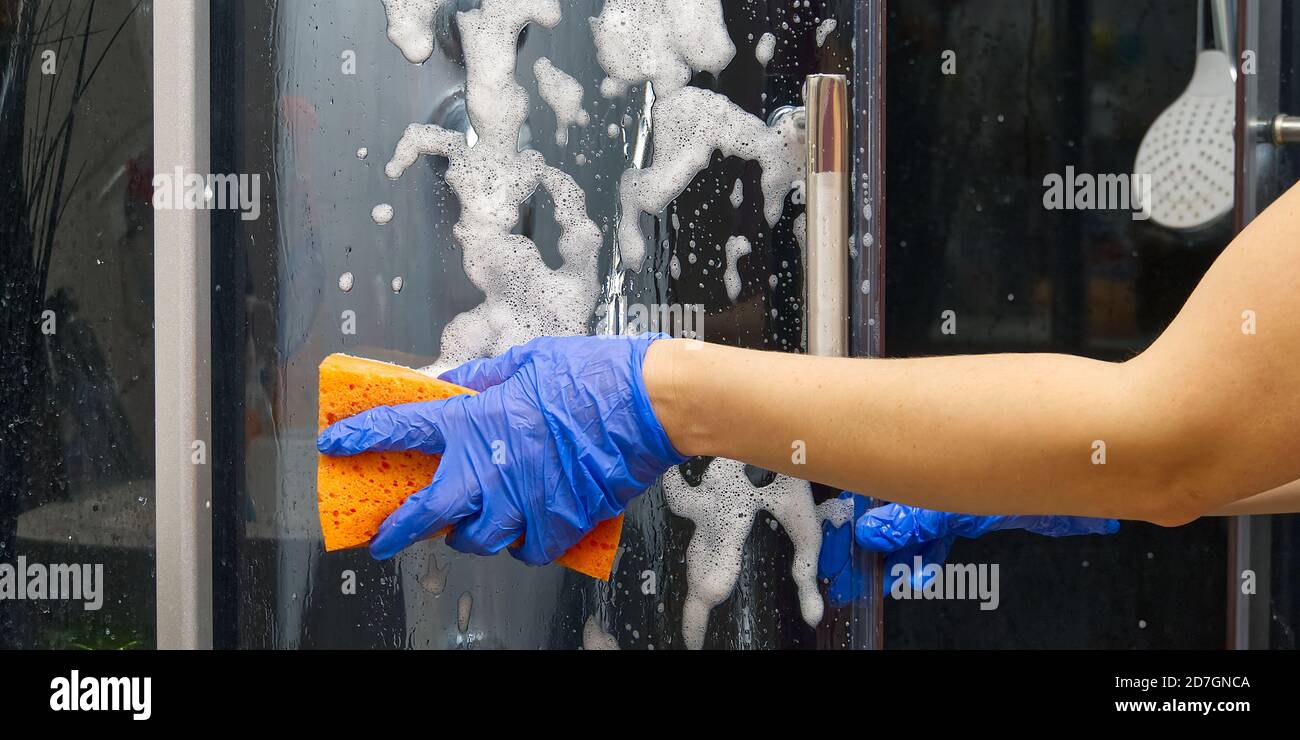 Cleaning of shower steam cabins from calcium deposits. Cleaning in the