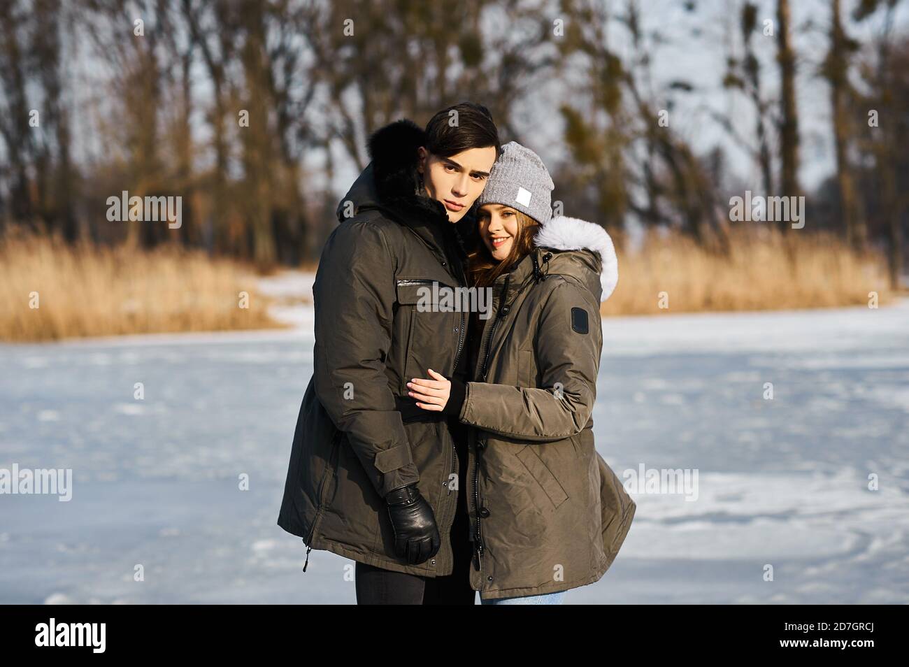 happy couple hugging and laughing outdoors in winter Stock Photo - Alamy