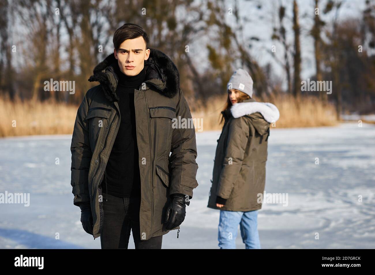 happy couple hugging and laughing outdoors in winter Stock Photo - Alamy