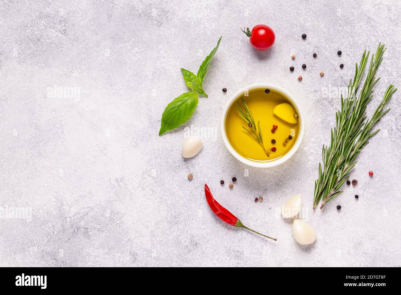 Herbs and condiments on light stone background. Top view with copy ...
