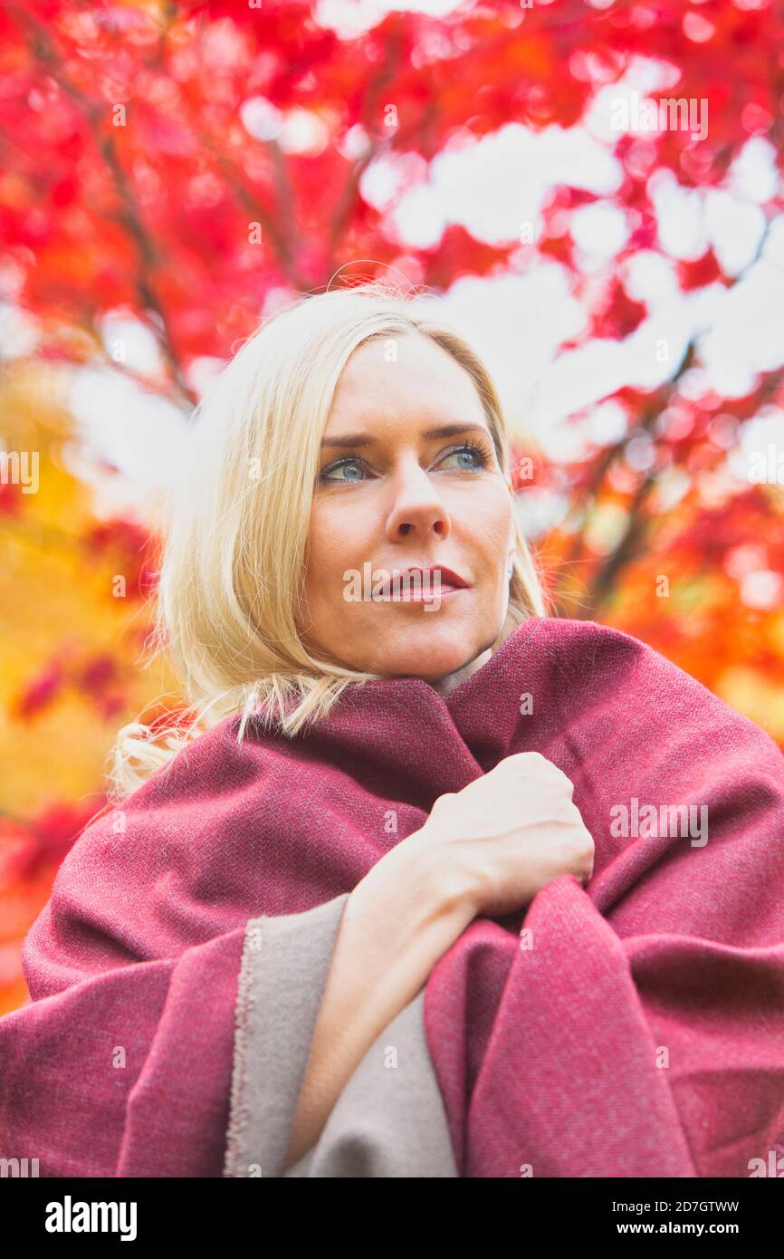 Carefree woman 40s smiling outdoors hi-res stock photography and images ...