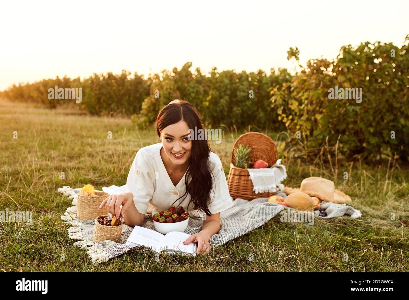 Beautiful girl enjoys outdoor picnic Stock Photo Alamy