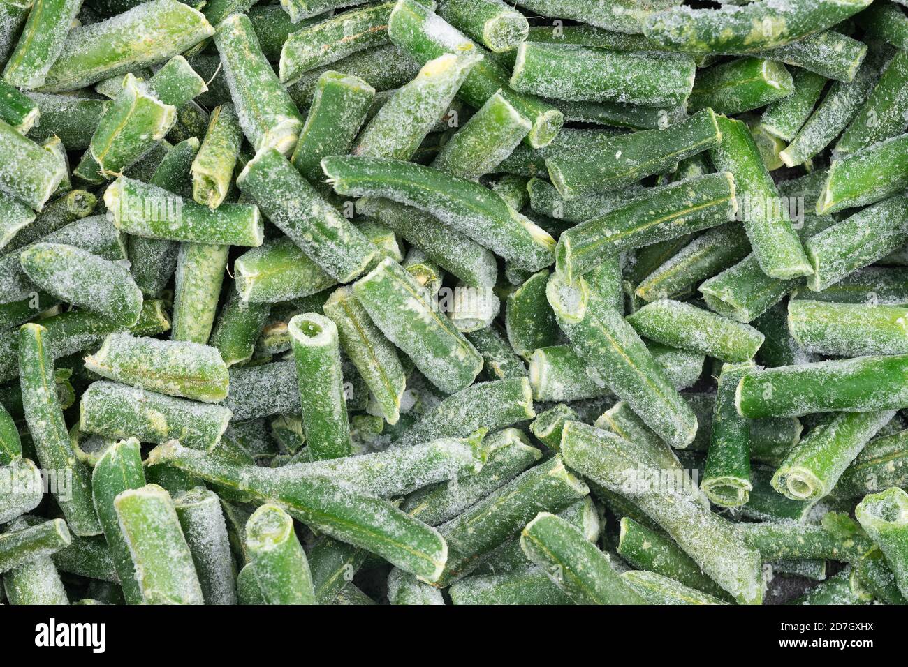 Frozen chopped green string beans texture background. iced beans background for food textures