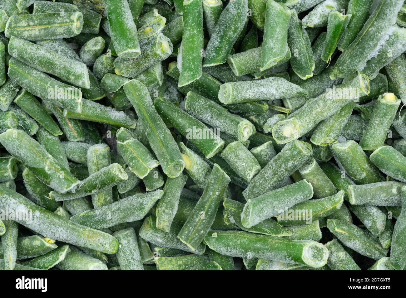 Frozen chopped green string beans texture background. iced beans background for food textures