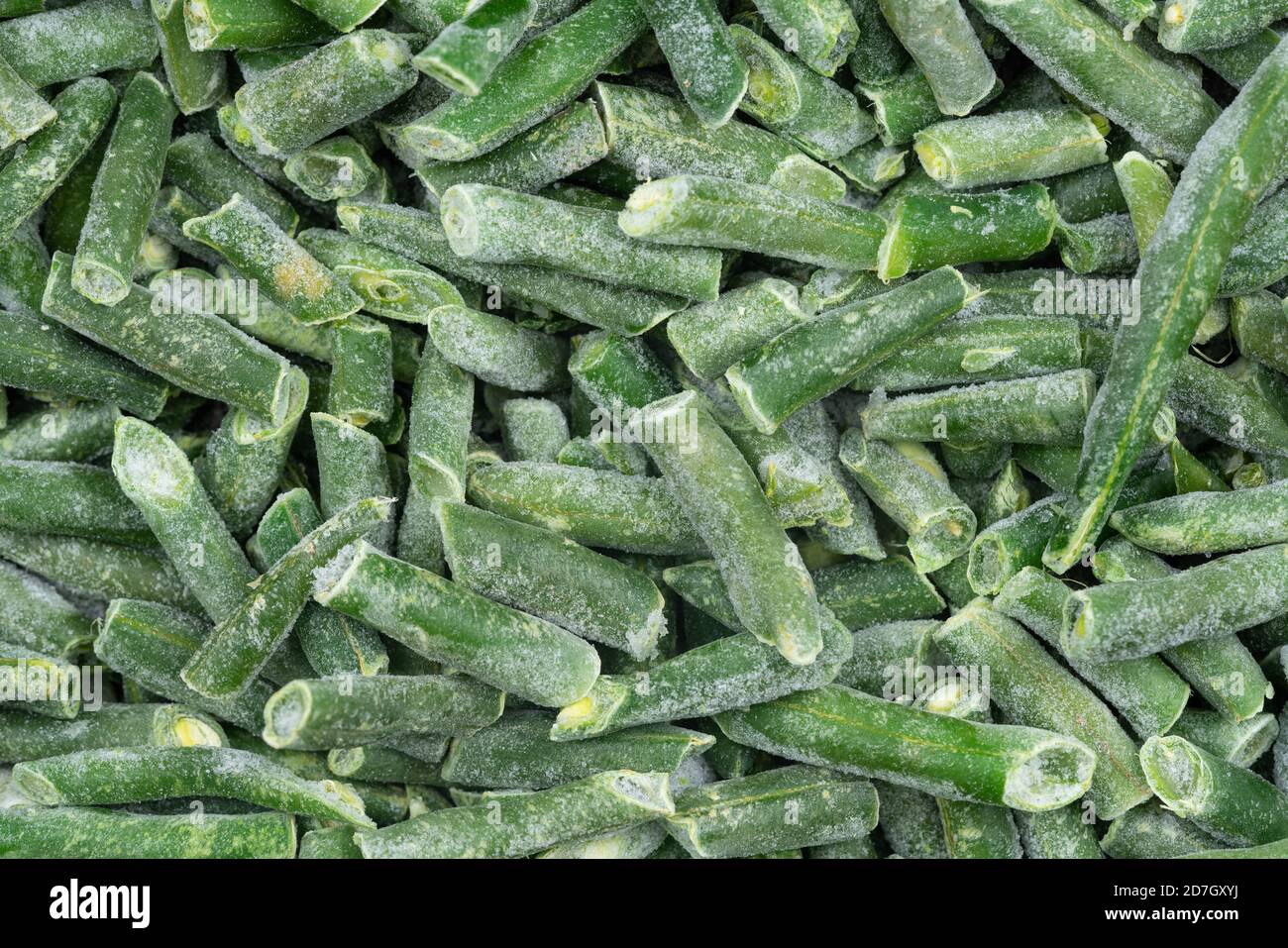 Frozen chopped green string beans texture background. iced beans background for food textures
