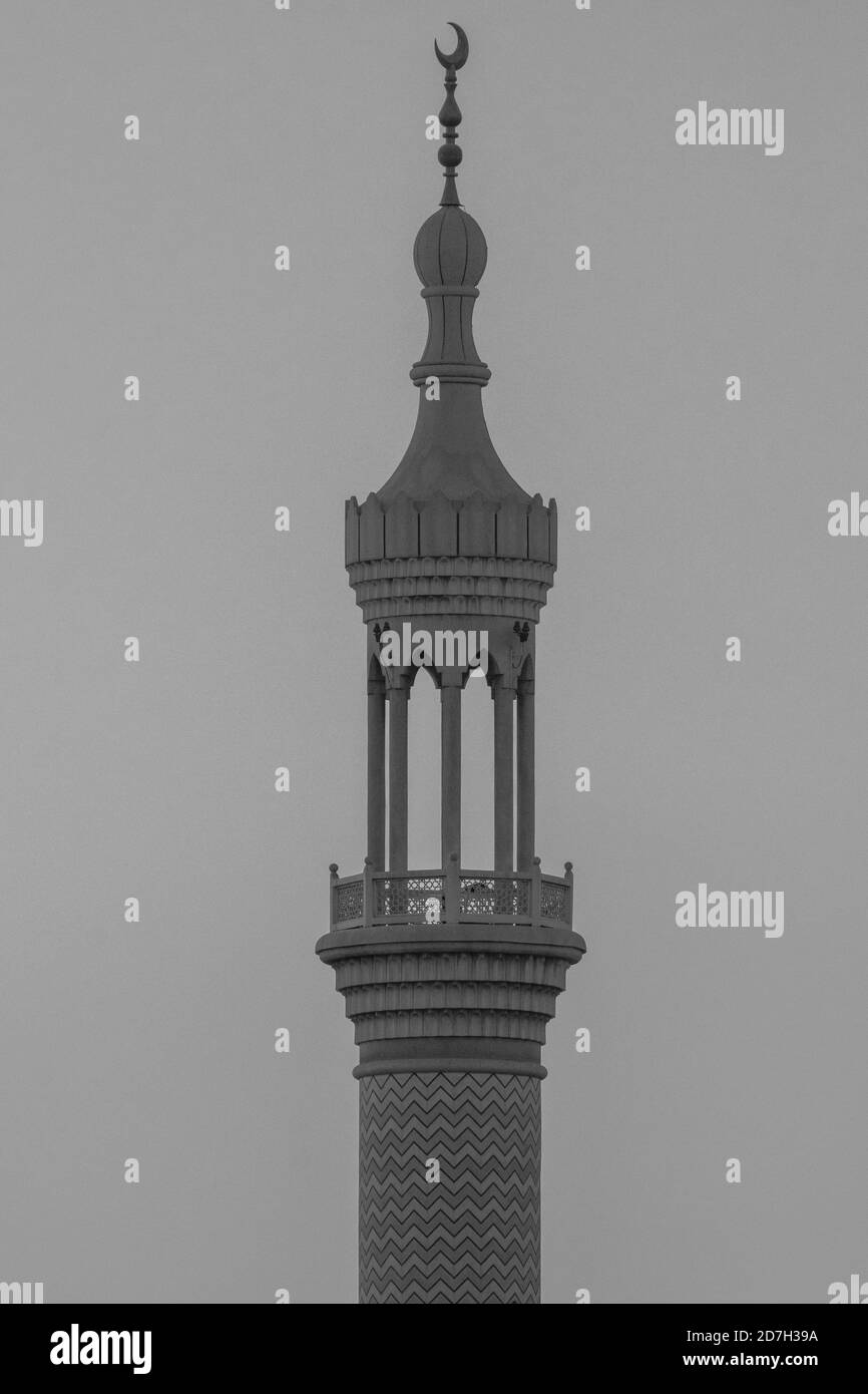 A spire and minaret of a islamic mosque in black and white. Religious  concepts Stock Photo - Alamy