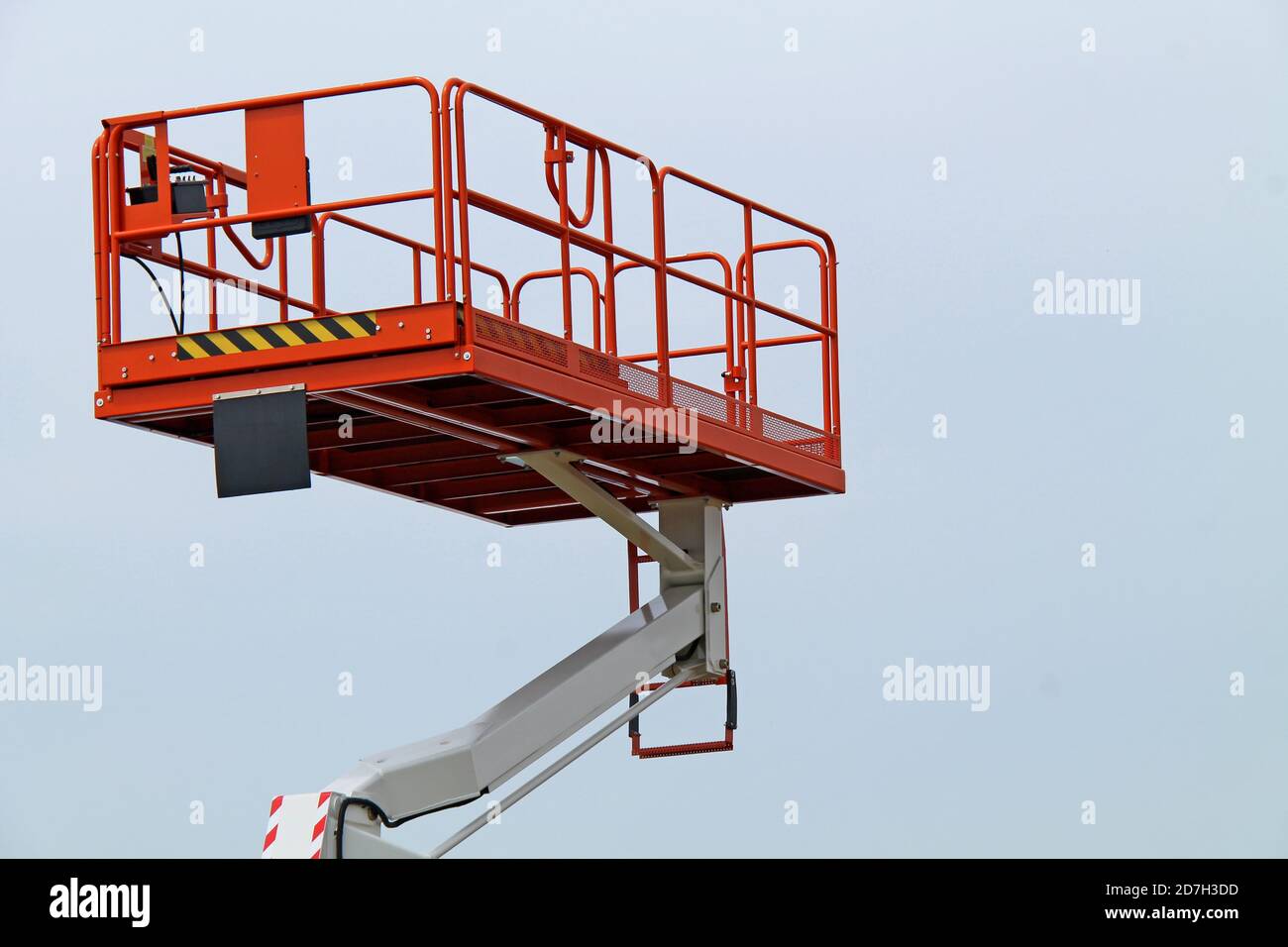 A Work Platform Cage on a Hydraulic Lifting Arm. Stock Photo