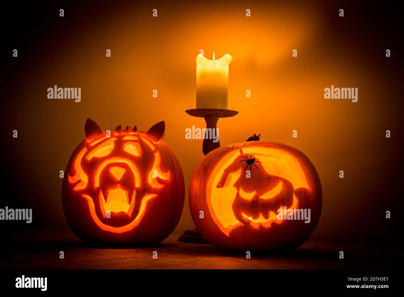 two carved pumpkins with candle creating spooky effect at halloween time Stock Photo
