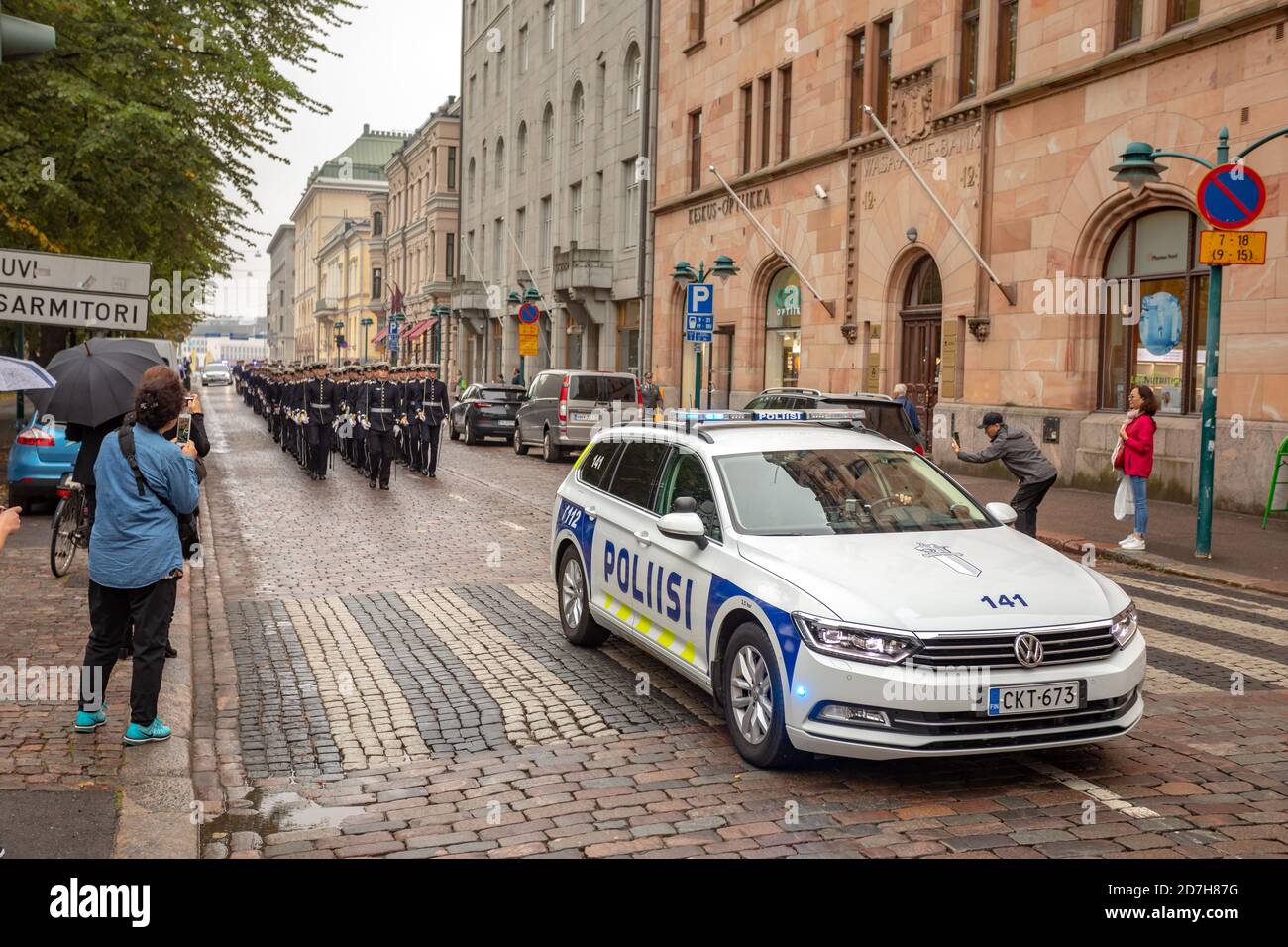 Police car assist Cadets of the National Defense University in Helsinki, Finland Stock Photo