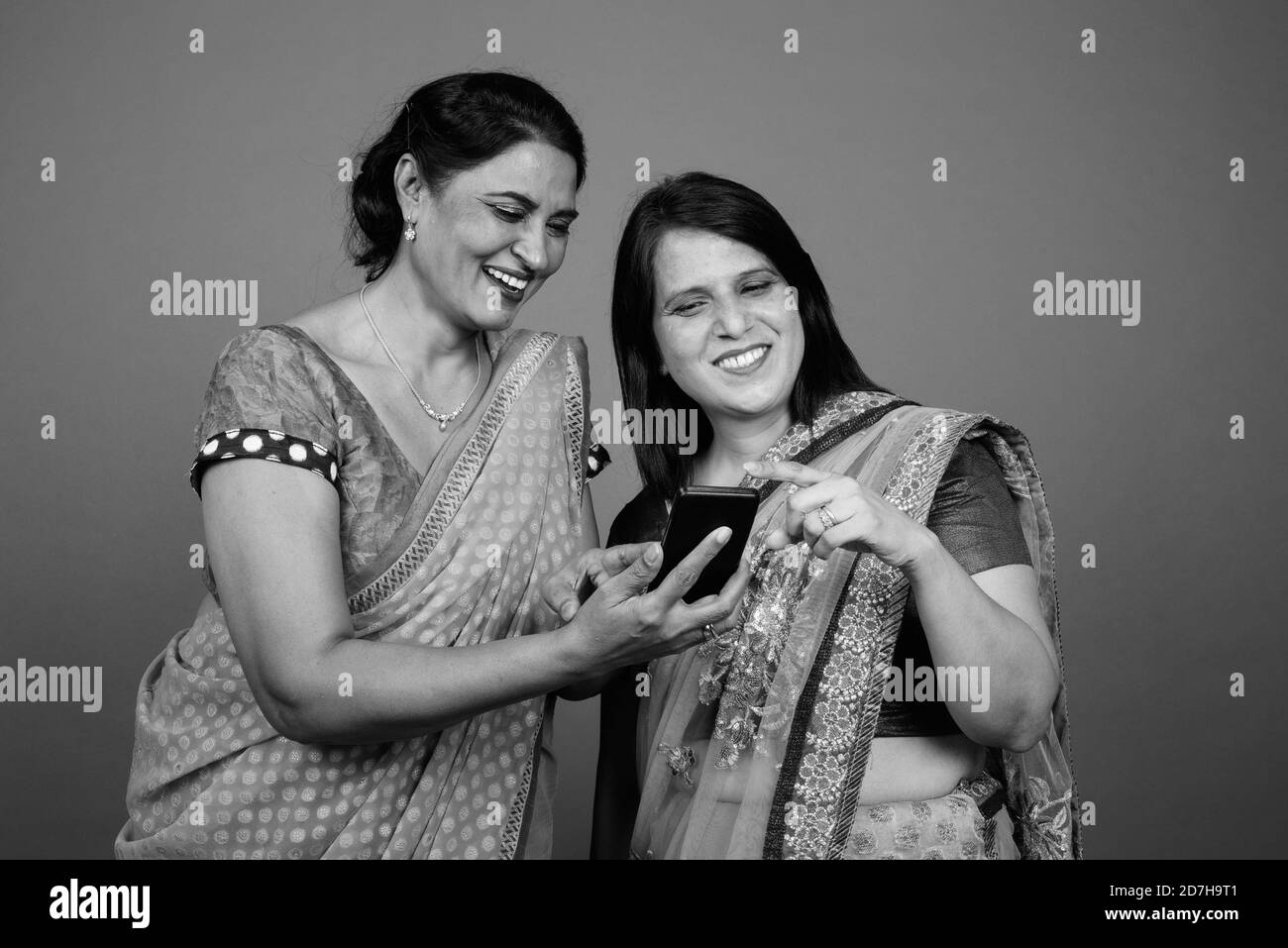 Two mature Indian women wearing Sari Indian traditional clothes together Stock Photo