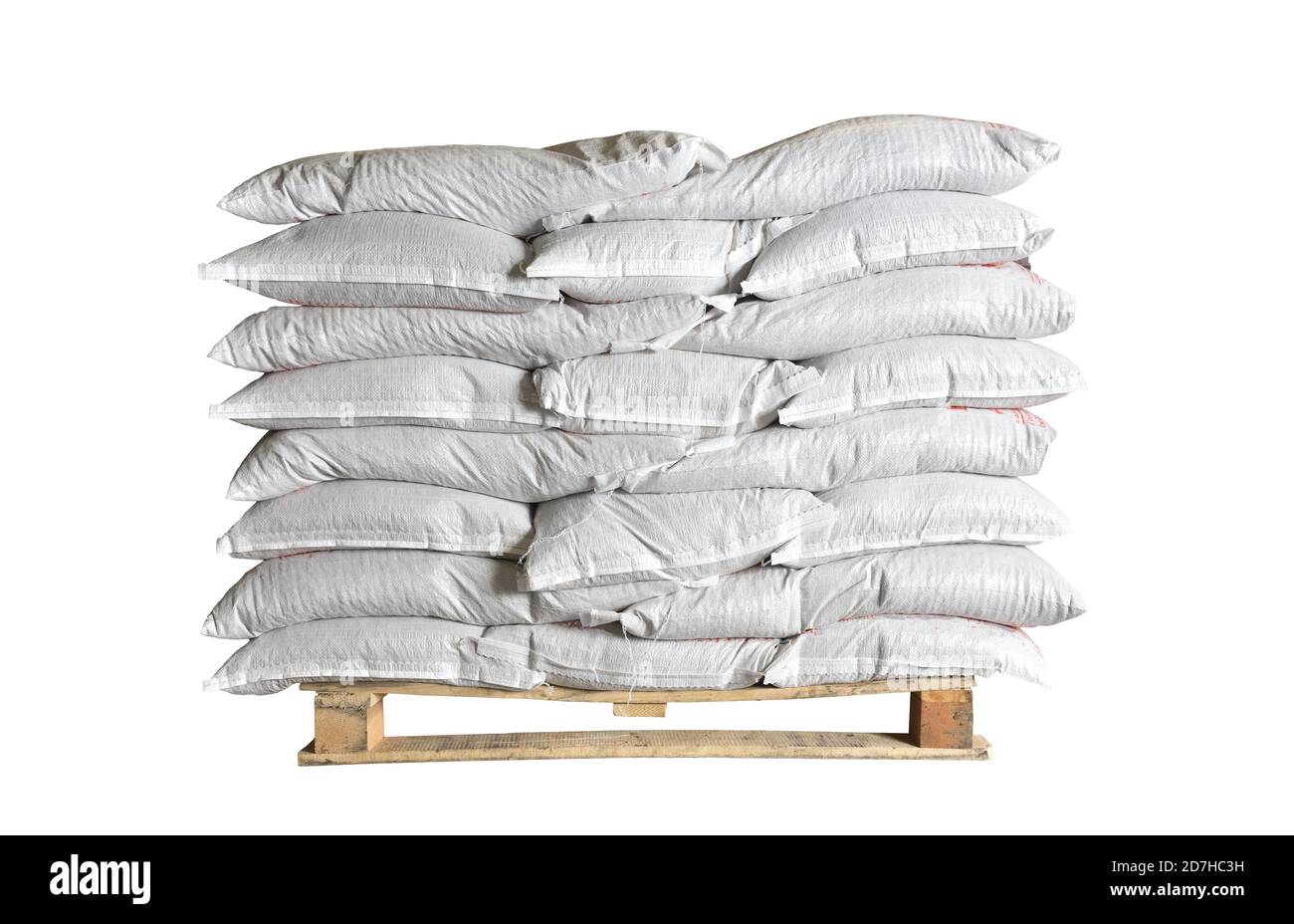 Full white bags stacked on a pallet on isolated white background Stock Photo