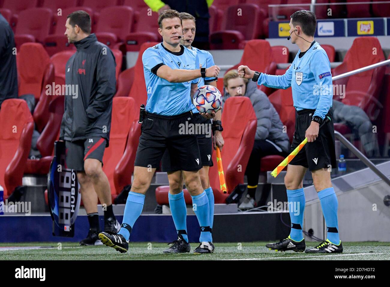 AMSTERDAM, NETHERLANDS - OCTOBER 21: Referee Felix Brych, Assistant Referee Mark Borsch, Assistant Referee Stefan Lupp during the UEFA Champions League match between Ajax and Liverpool at the Johan Cruijff Arena on October 21, 2020 in Amsterdam, Netherlands (Photo by Gerrit van Keulen/Orange Pictures) Stock Photo