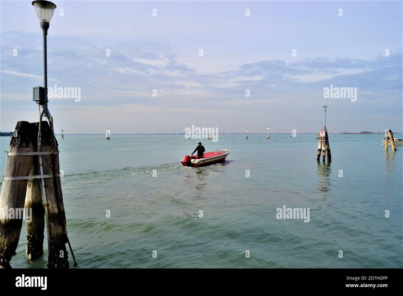 Man in the on the boat. City of gondolas: Venice (Venedig) and another point of view. Stock Photo