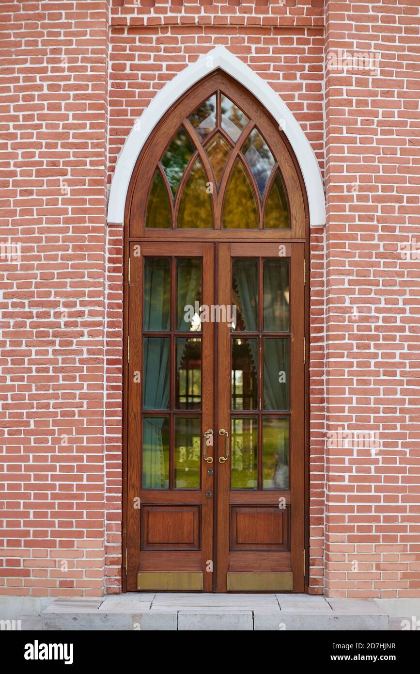 Antique door in the form of an arch with a pointed top Stock Photo