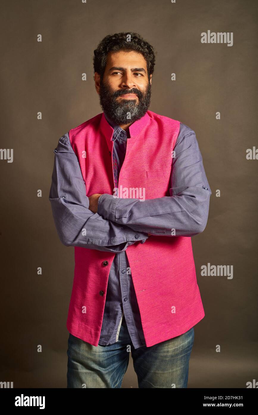 A young Indian man with a typical 'artist' and 'intellectual' look ...