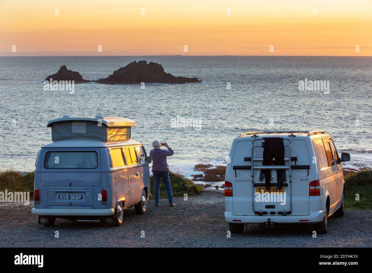 Camper vans at Cape Cornwall, Cornwall, UK, at sunset with the Brissons  behind Stock Photo - Alamy