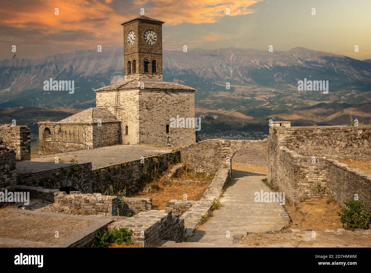 Sunset over clock tower and fortress at Gjirokaster castle, Albania Stock Photo