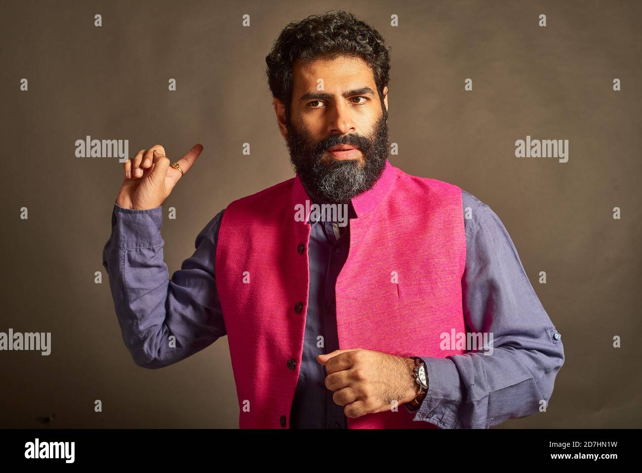 A young Indian man with a typical 'artist' and 'intellectual' look ...