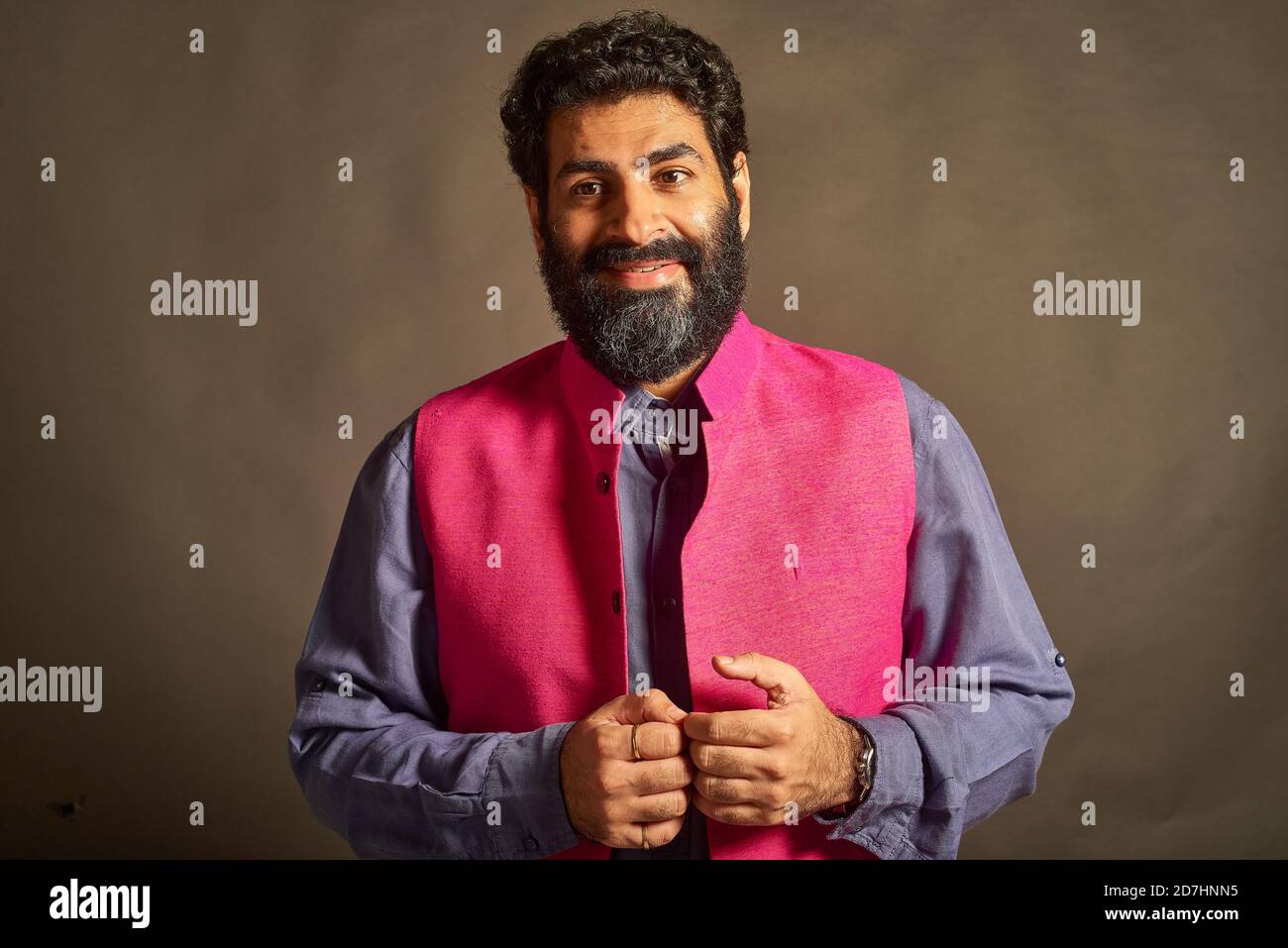 A young Indian man with a typical 'artist' and 'intellectual' look ...