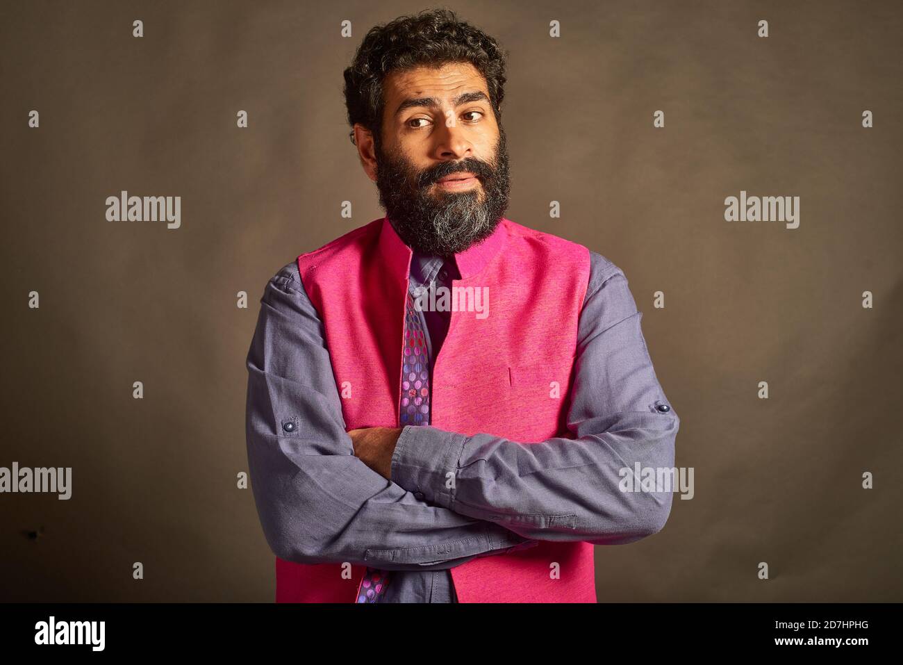 A young Indian man with a typical 'artist' and 'intellectual' look ...