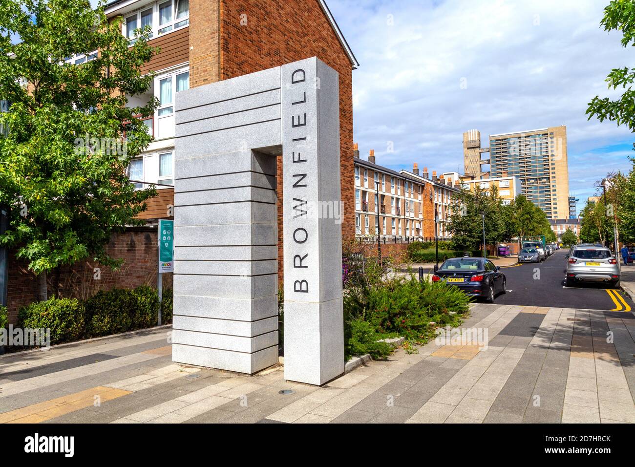 Sign for the Brownfiled Estate in Poplar with the Balfron Tower in the background, London, UK Stock Photo