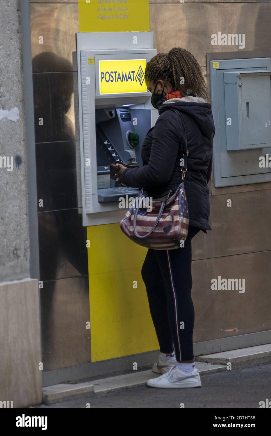 terni,italy october 23 2020:black woman at post office cash machine Stock Photo