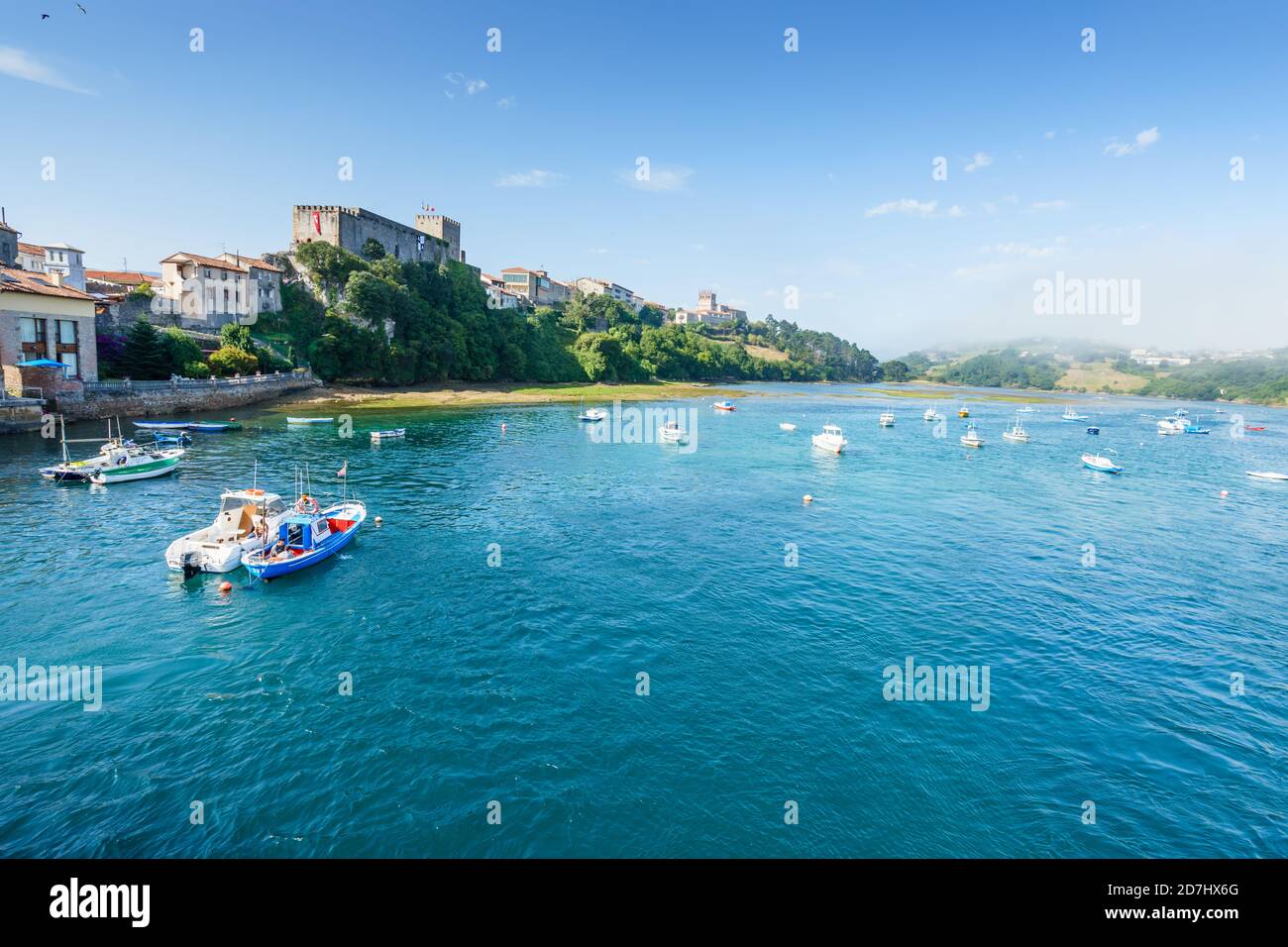 Idyllic Summer Setting Idyllic summer landscape with a river under a blue sky with white ...