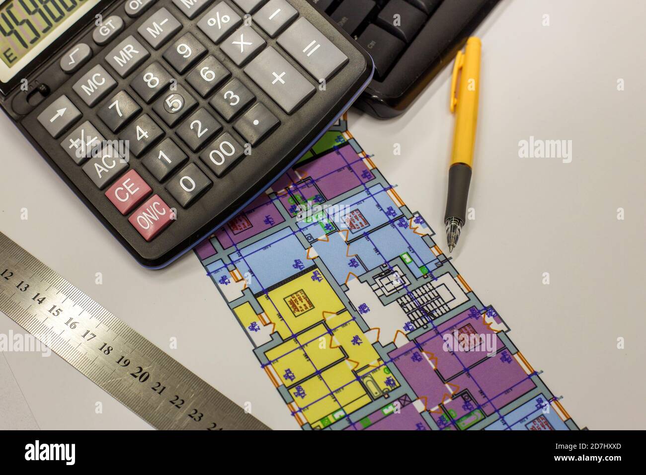 Top view of calculator, pen and ruler on blueprint plan of architecture building. Planning