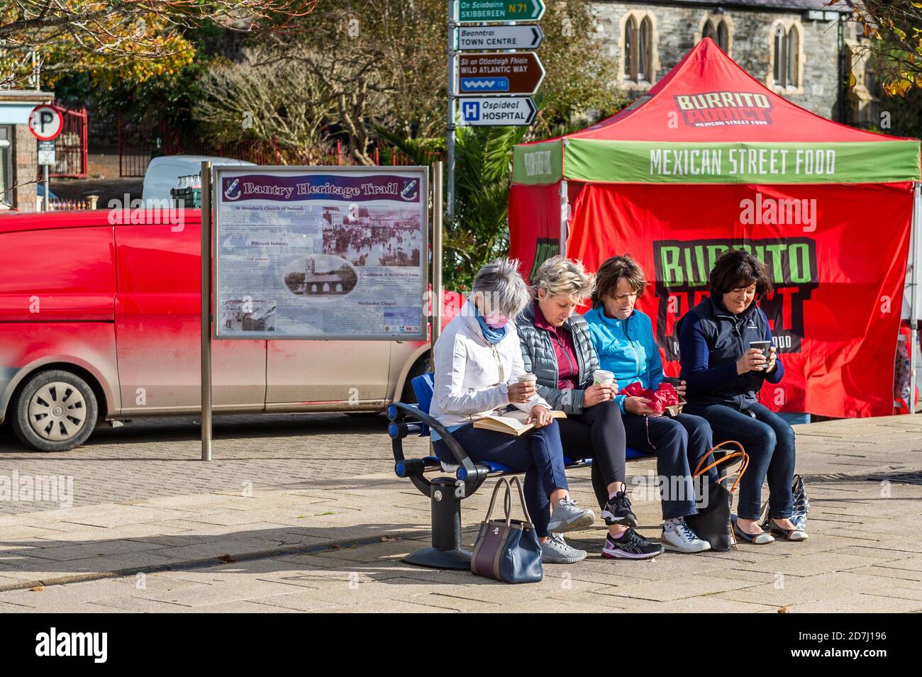 Bantry, West Cork, Ireland. 23rd Oct, 2020. Bantry Friday Market is operating today and is quieter than usual. Many people took the opportunity to meet their friends in the sunshine. Credit: AG News/Alamy Live News Stock Photo
