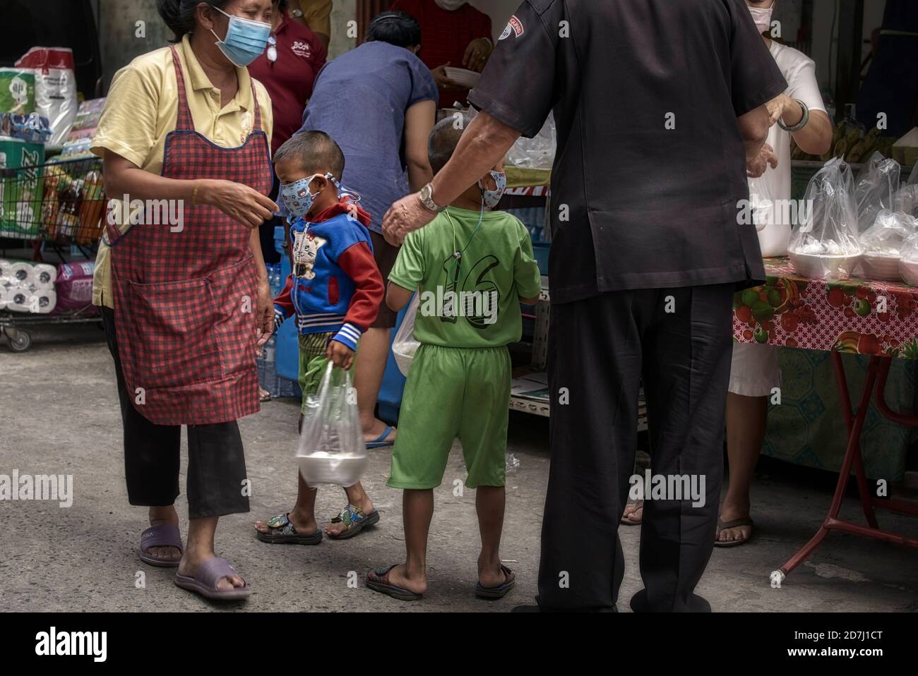 Children receiving free food in celebration of Chulalongkorn Day, King Rama V, Thailand Southeast Asia Stock Photo
