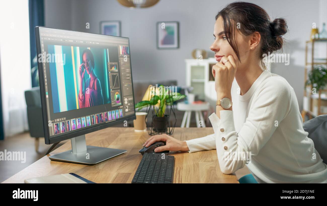 Professional Female Photographer Works in Photo Editing App Software on His Personal Computer. Photo Editor Retouching Photos of Beautiful Girl. Mock Stock Photo