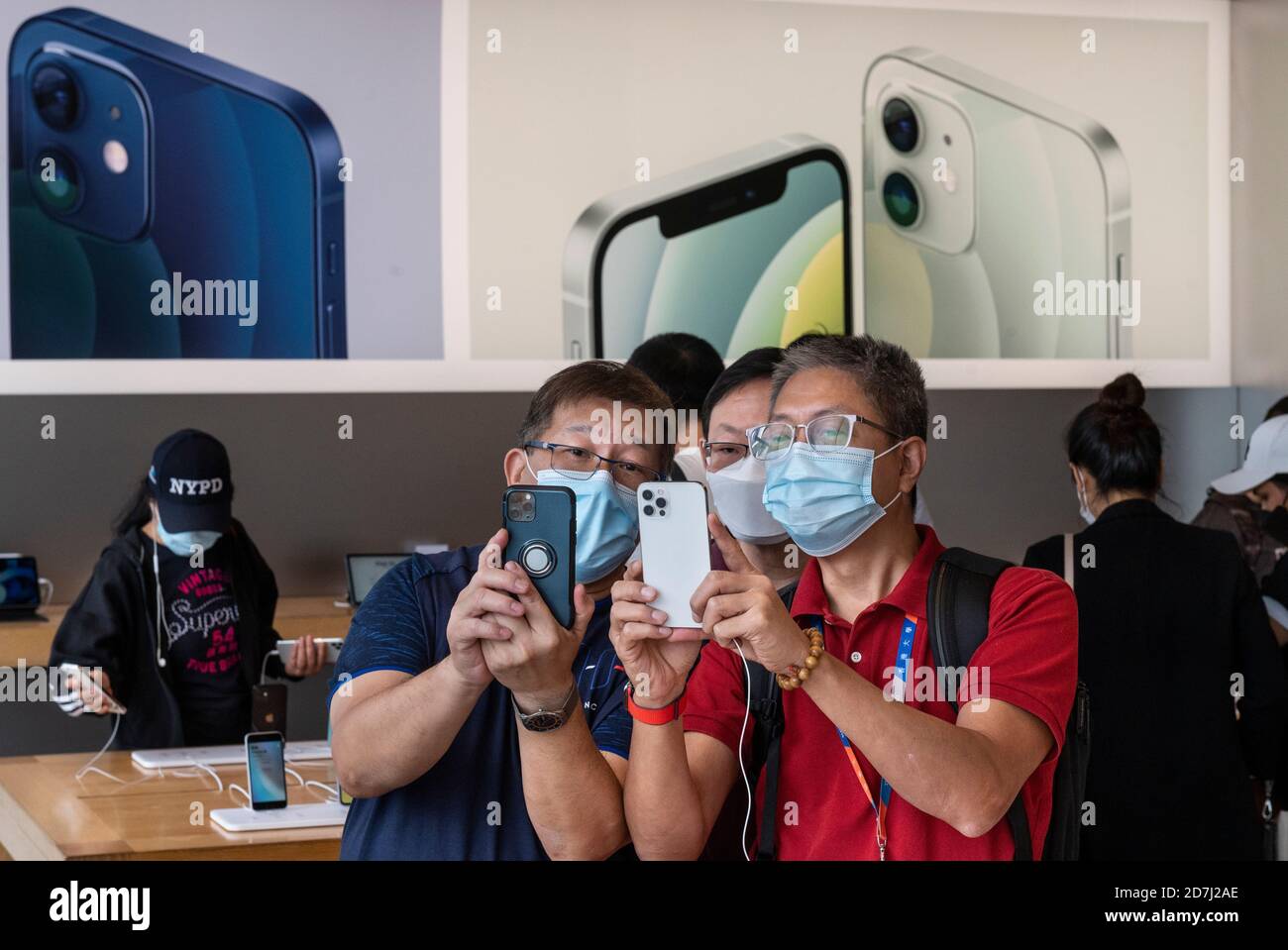 A Salesperson and Customers at an Apple Store Looking at the Latest Apple  IPhone 12 Models for Sale Editorial Stock Photo - Image of consumerism,  design: 203627358