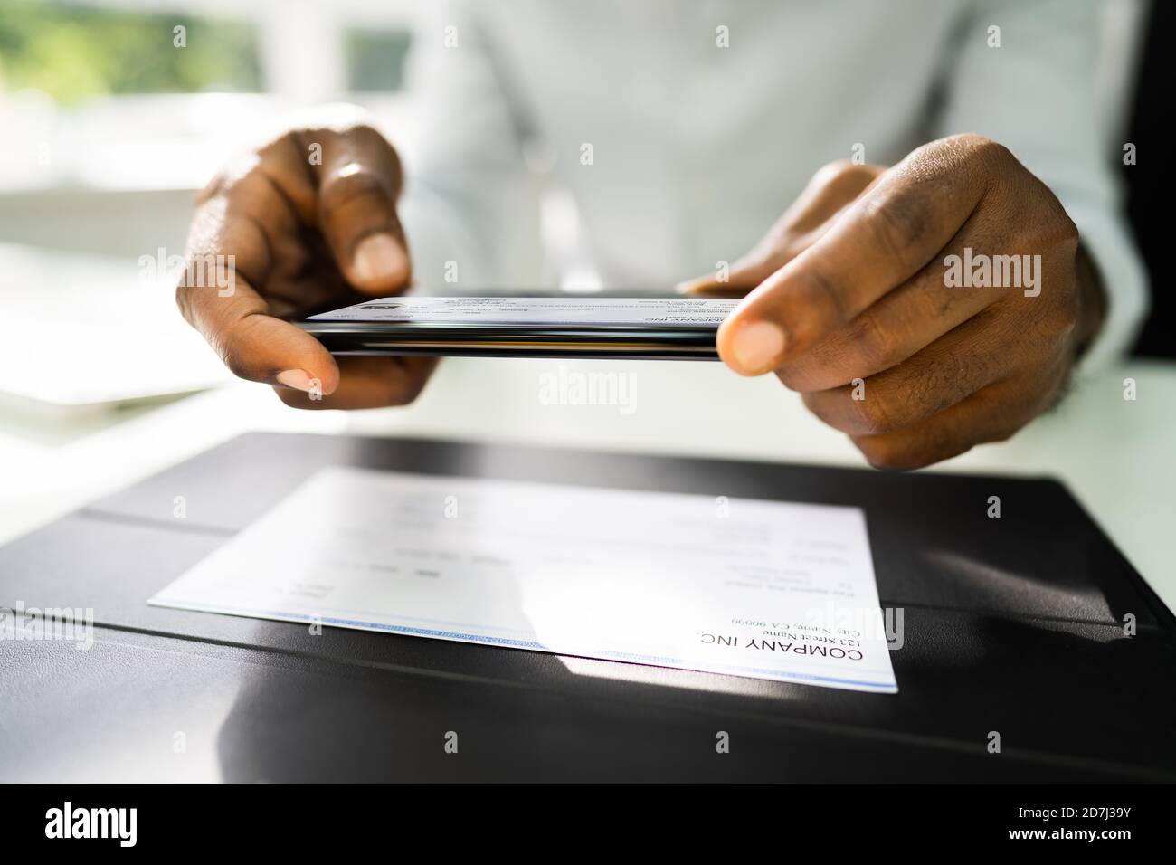 Remote Check Deposit Using Mobile Photo Scanning Stock Photo Alamy