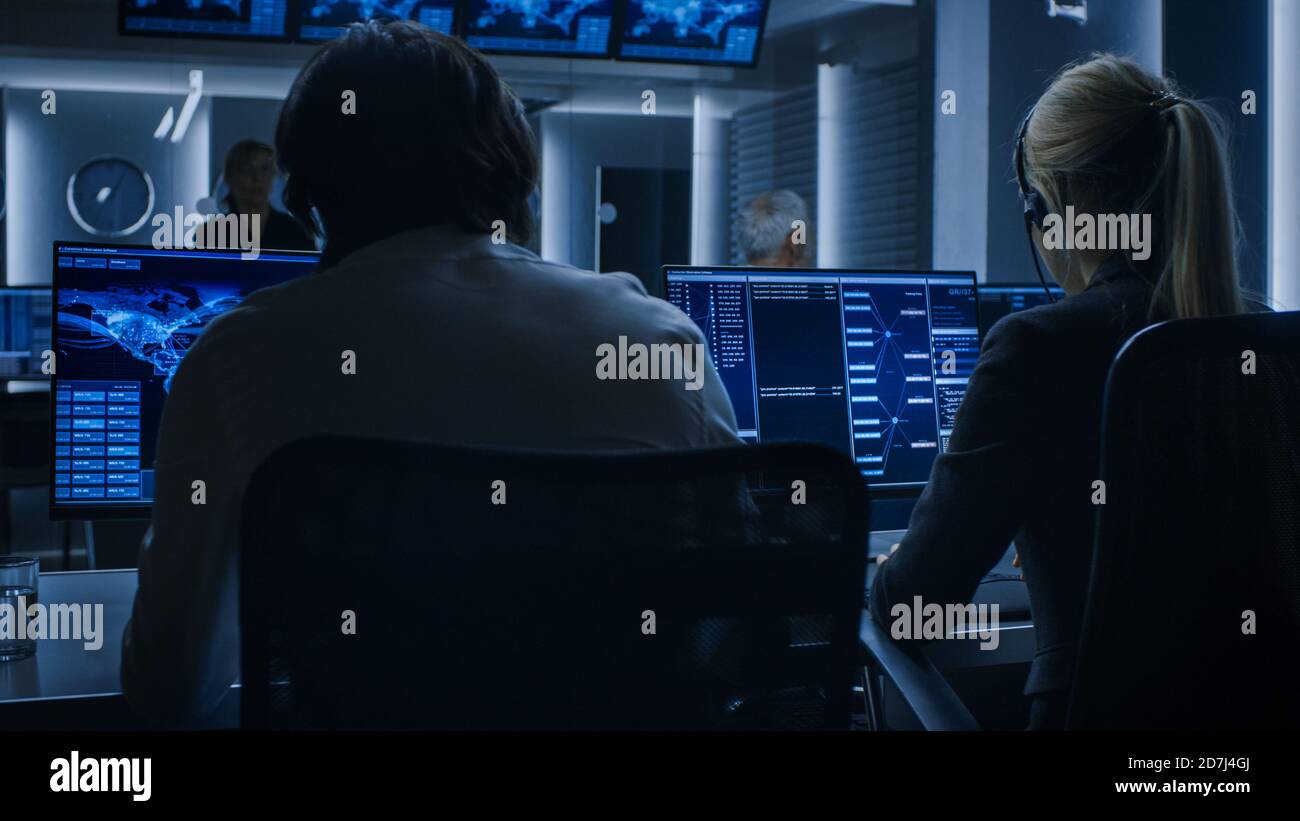 Back View of the Cyber Security Dispatchers Working on Personal ...