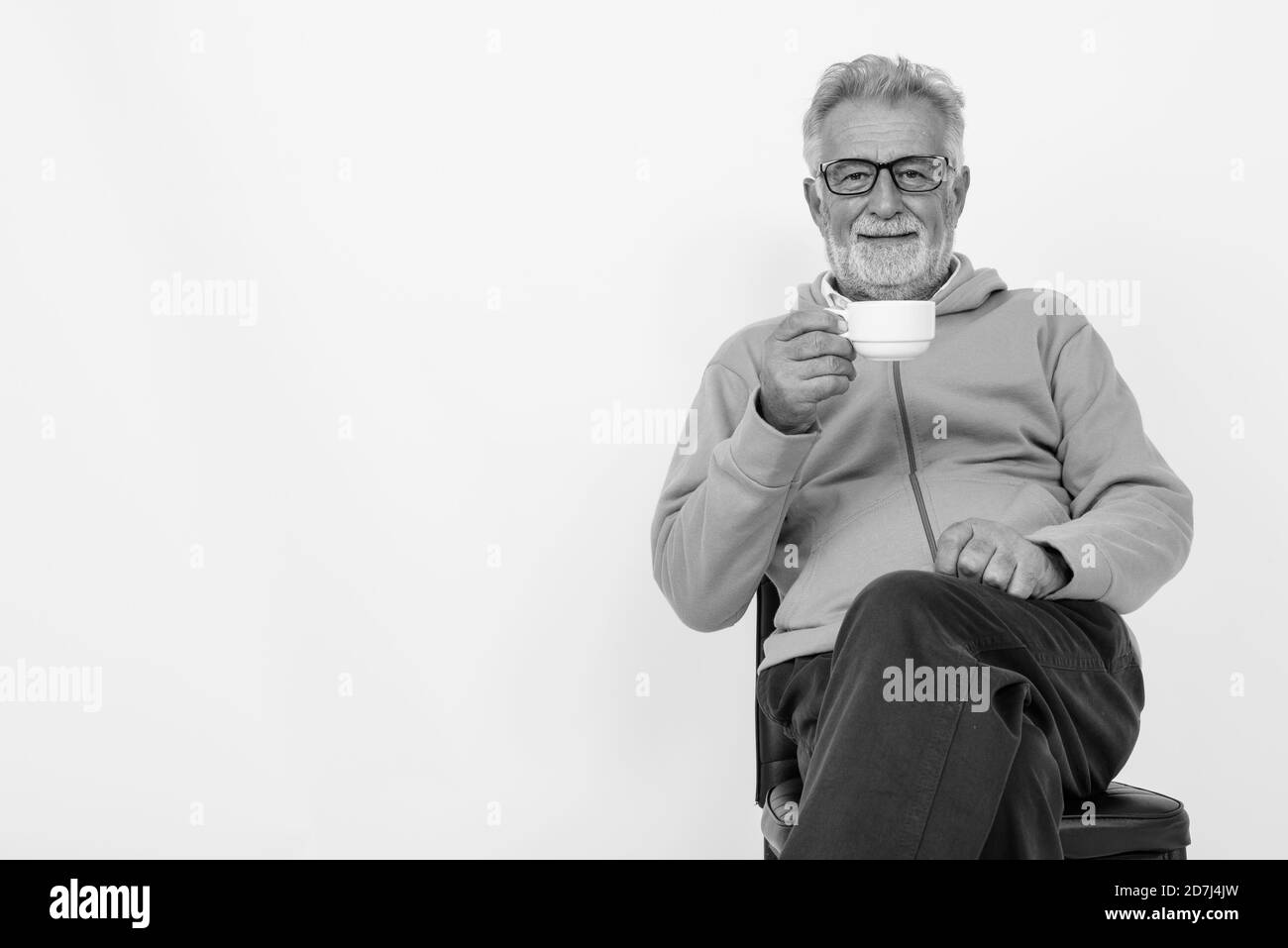 Old man sitting chair Black and White Stock Photos & Images - Alamy