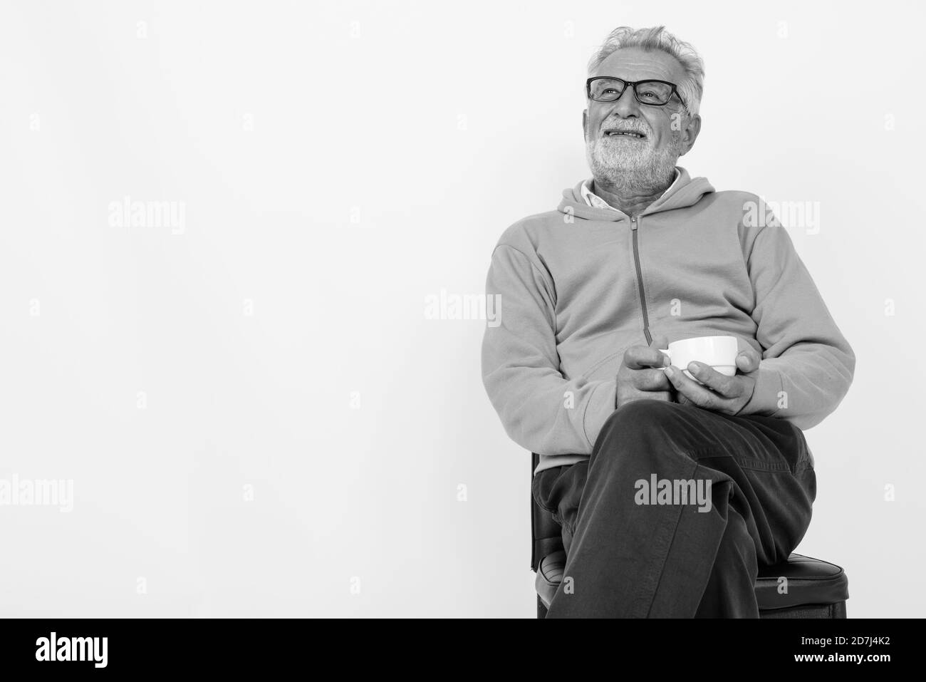 Old man sitting chair Black and White Stock Photos & Images - Alamy