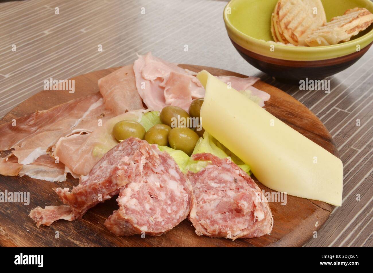 Assorted ham, hamon, salami, olive and cheese platter for snack at venice, Italy. Stock Photo