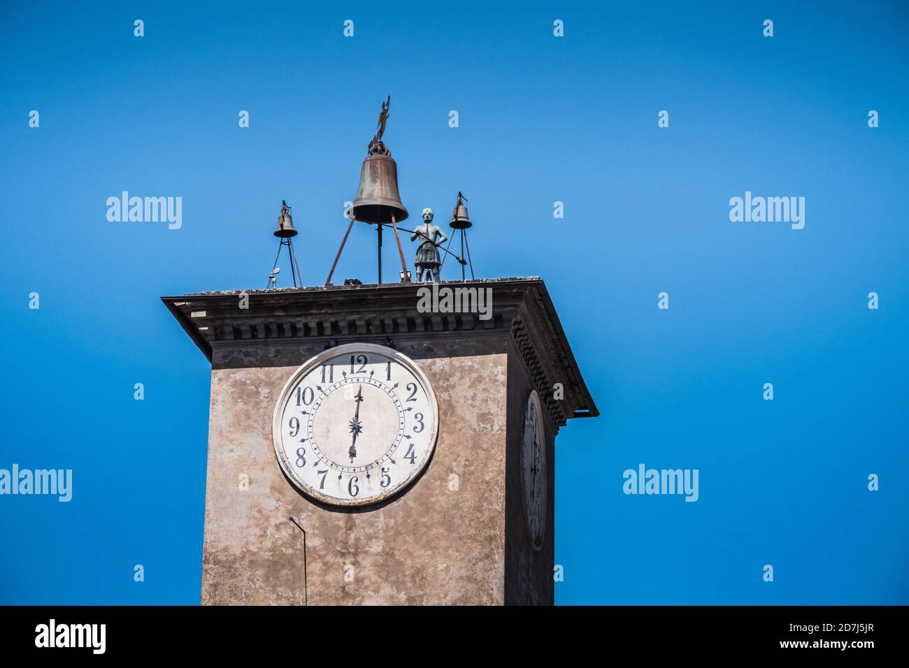 Maurizio's Tower with Bell and Bronze Statue in Orvieto, Italy, a mechanical Clock Tower with Bells and an Automaton Stock Photo