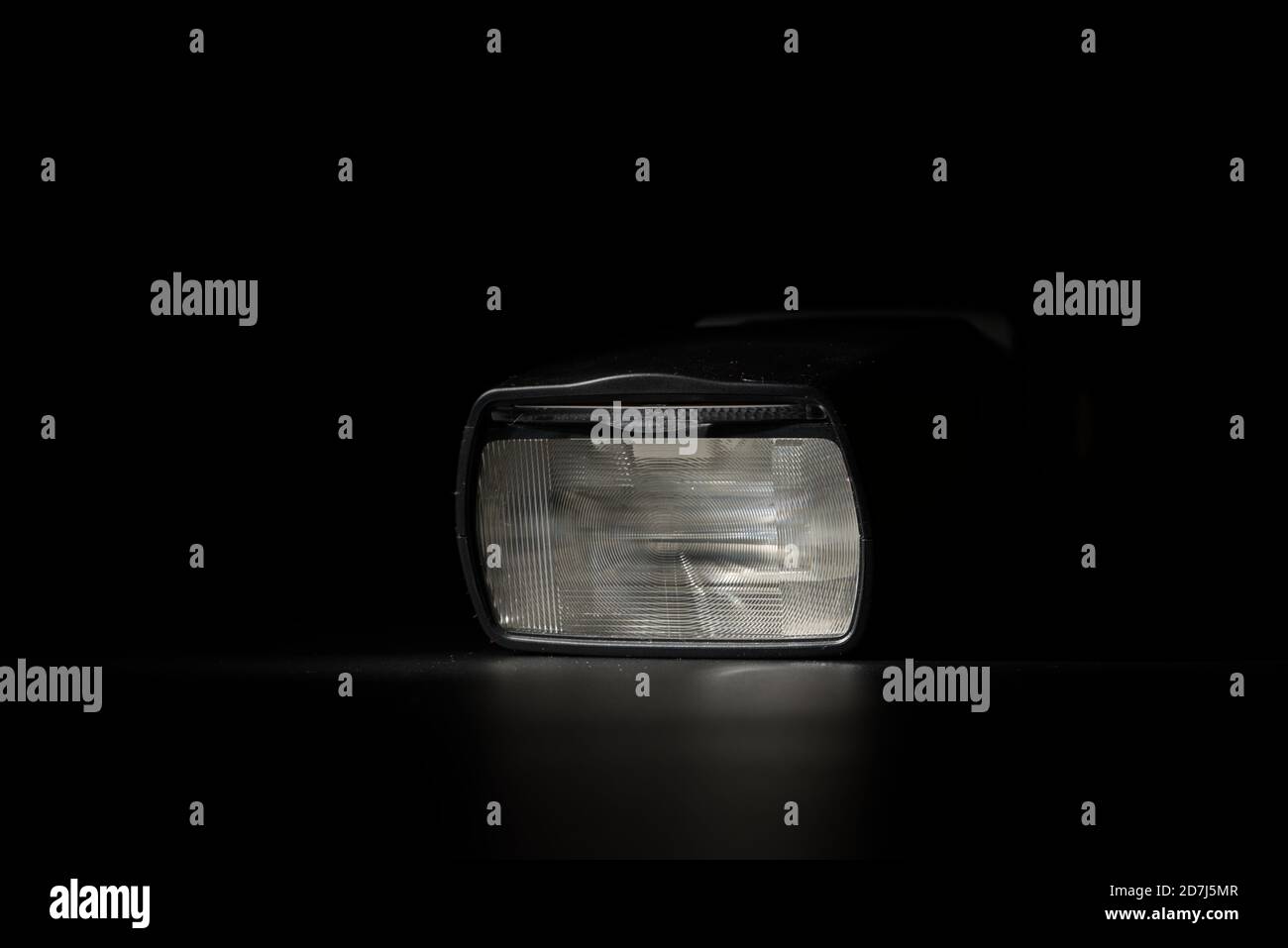 Flashlight head on black background in low key light Stock Photo