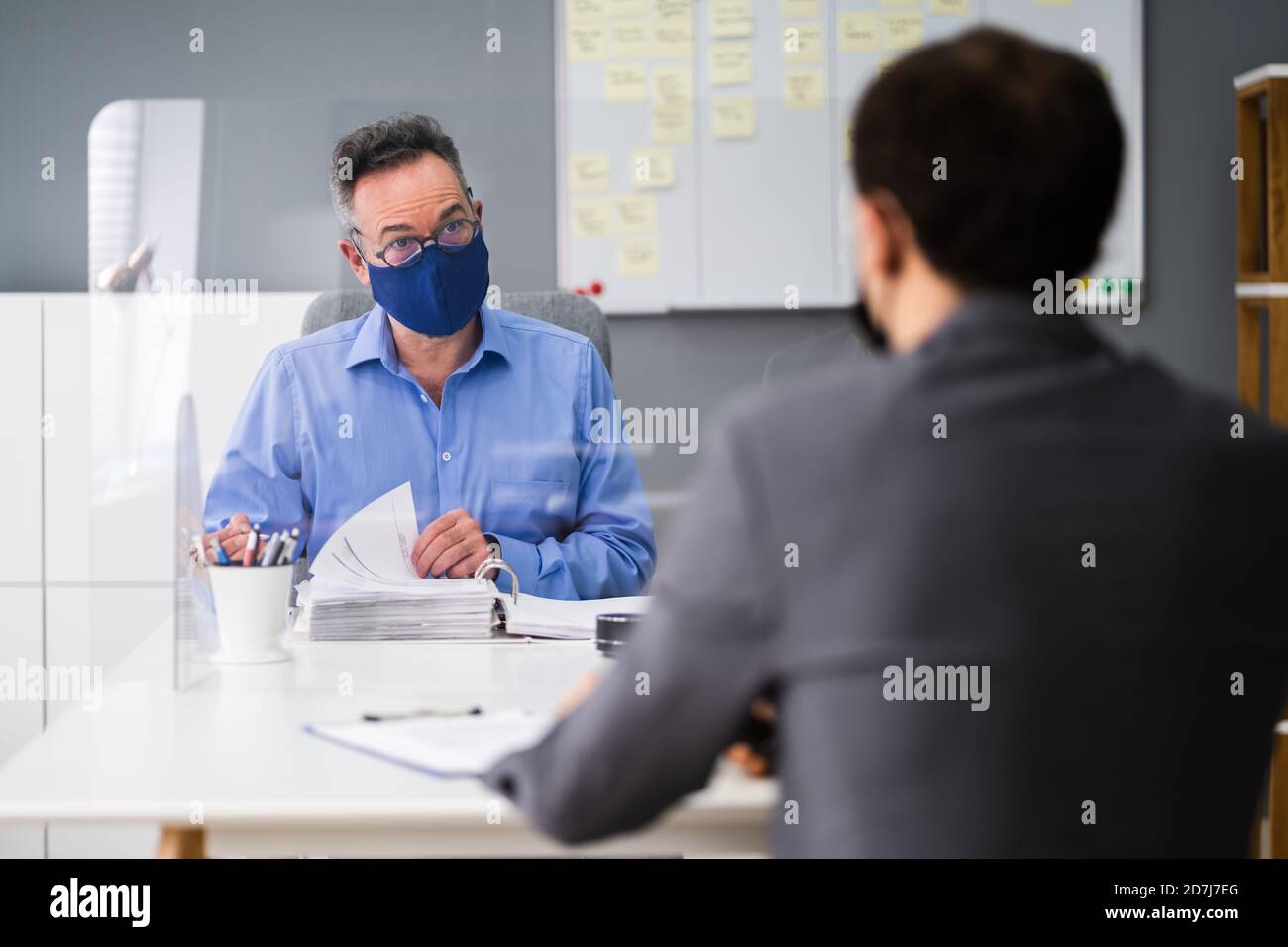 Business Tax Consultant Or Advisor Meeting With Face Mask Stock Photo