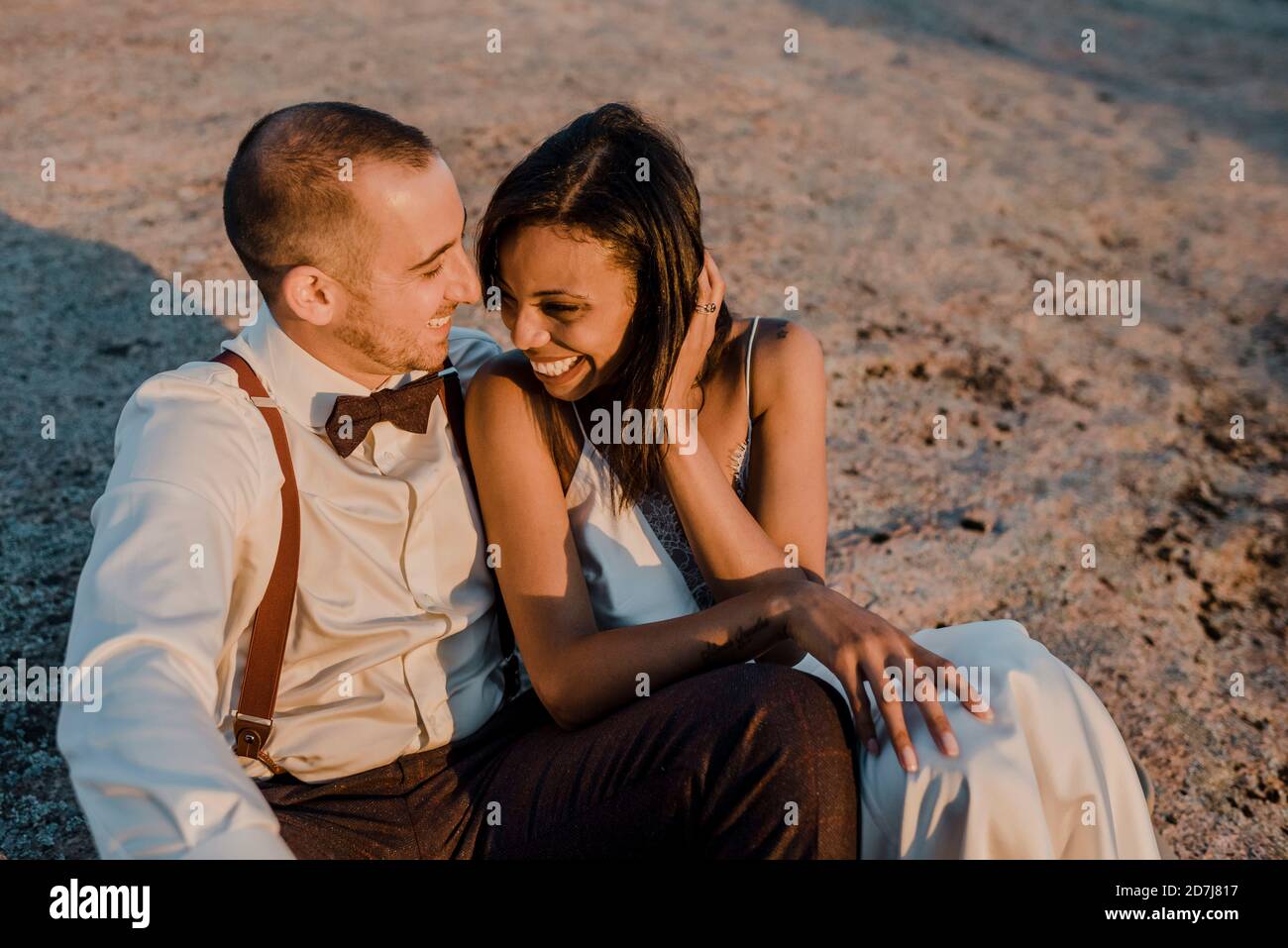 Bride and groom sitting smiling hi-res stock photography and images - Alamy