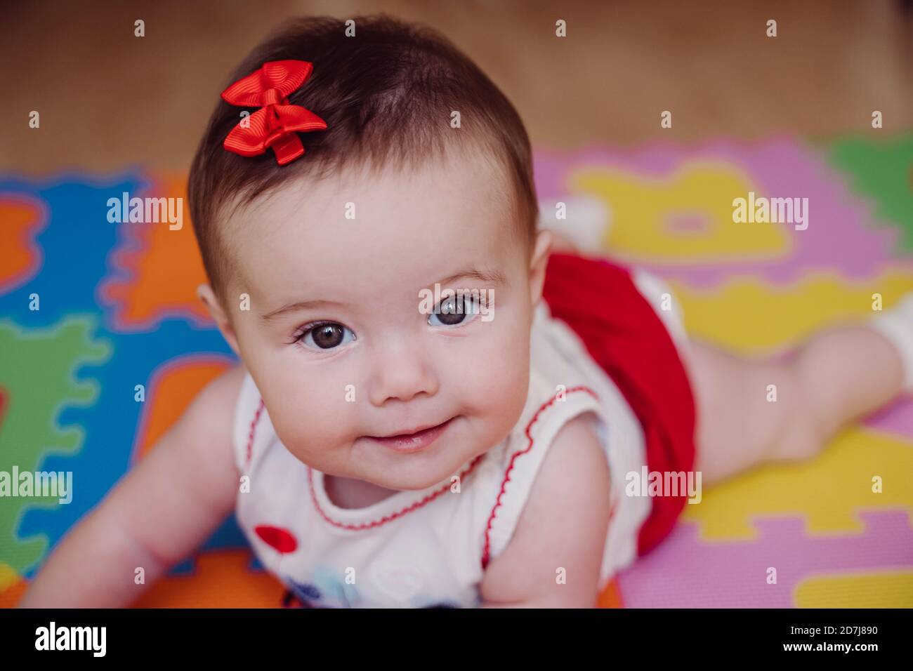 Close Up Of Cute Smiling Baby Girl Lying On Puzzle Playmat At Home Stock Photo Alamy Close Up Of Cute Smiling Baby Girl Lying On Puzzle Playmat At Home Stock Photo Alamy