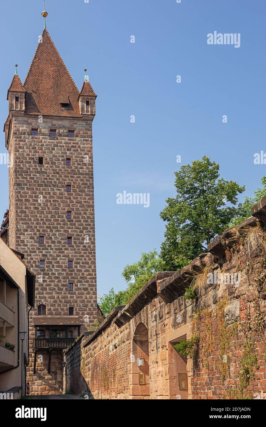 A watchtower of the Nuremberg Castle in the middle of a residential area Stock Photo