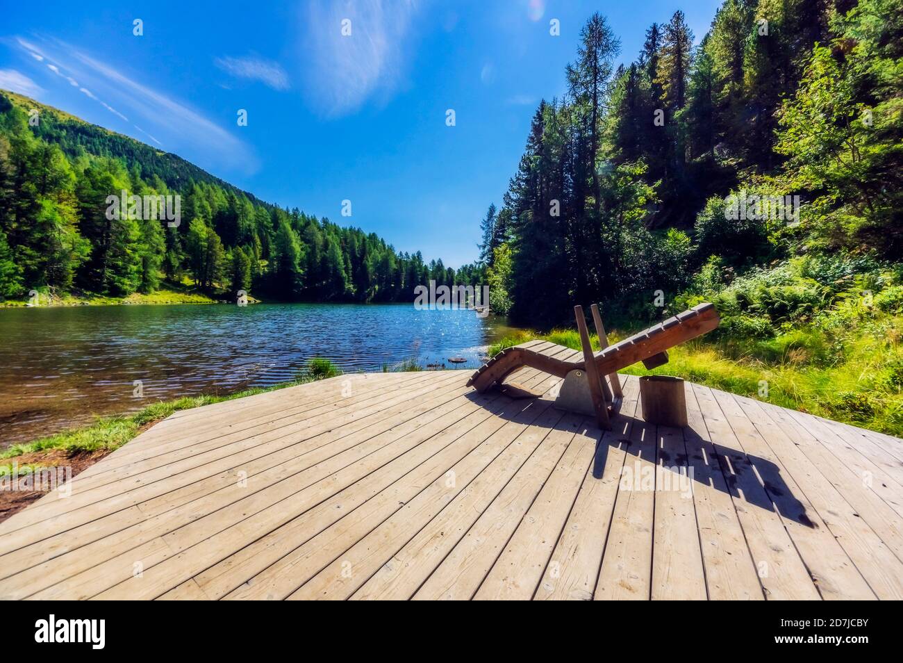 Deck chair on jetty by lake at Turracher Hoehe, Gurktal Alps, Austria Stock Photo