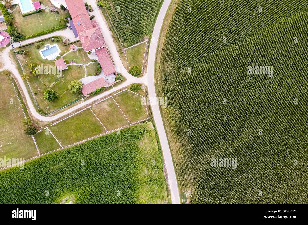 Drone view of green fields and rural villa Stock Photo