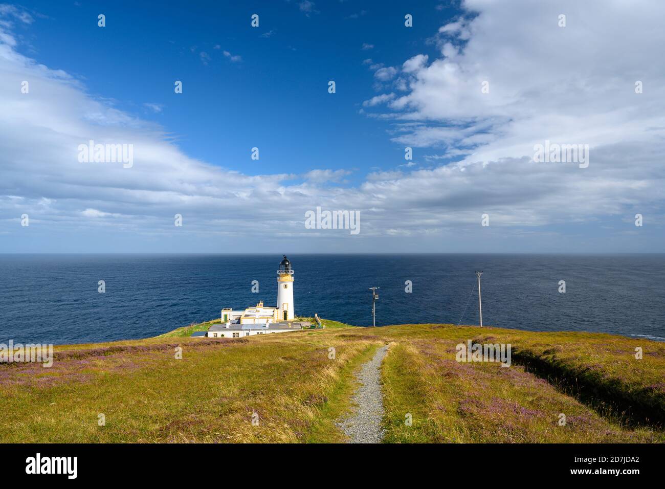 UK, Scotland, Tiumpan Head Lighthouse with clear line of horizon over sea in background Stock Photo
