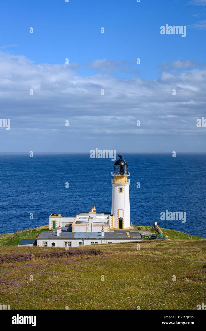 UK, Scotland, Tiumpan Head Lighthouse with clear line of horizon over sea in background Stock Photo